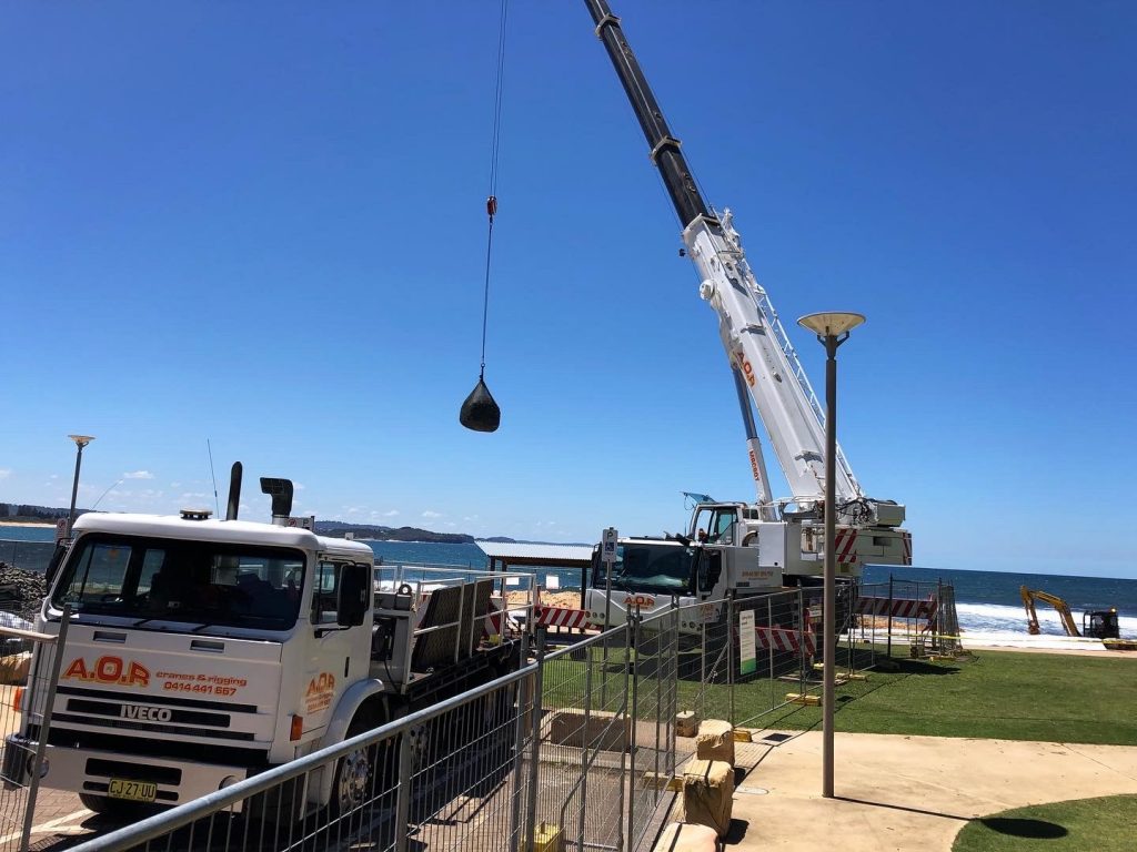 Crane at beach Hire a crane in Roseville